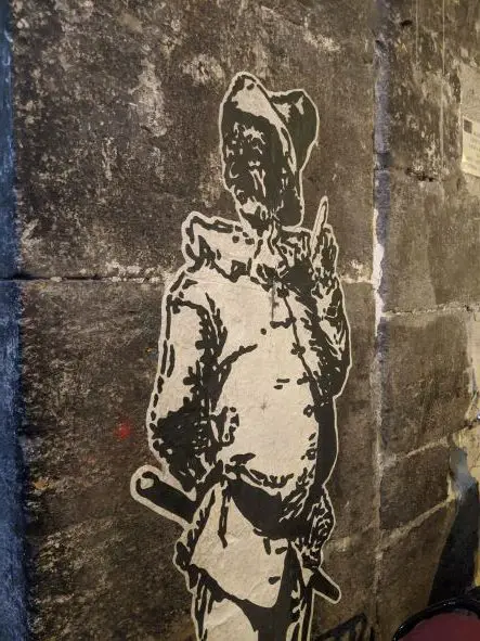 Things to do in Naples - Italian white and black street art of a traditional looking man