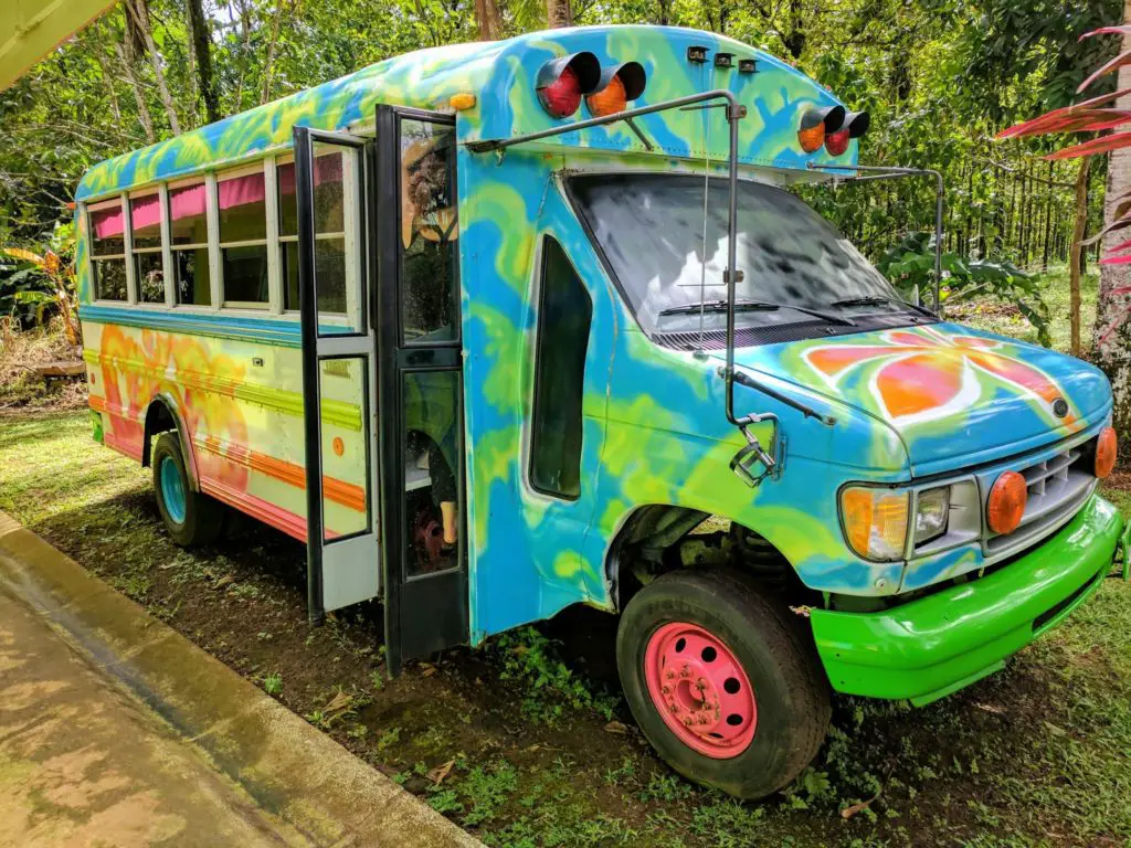 Costa Rica Itinerary - A colourful patterned group tour bus in Sarapiqui