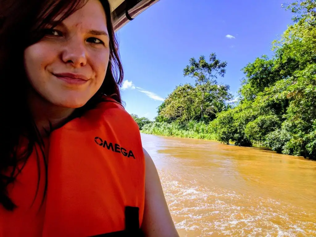 Costa Rica Itinerary - woman in lifejacket enjoying a boat taxi on Tortuguero river