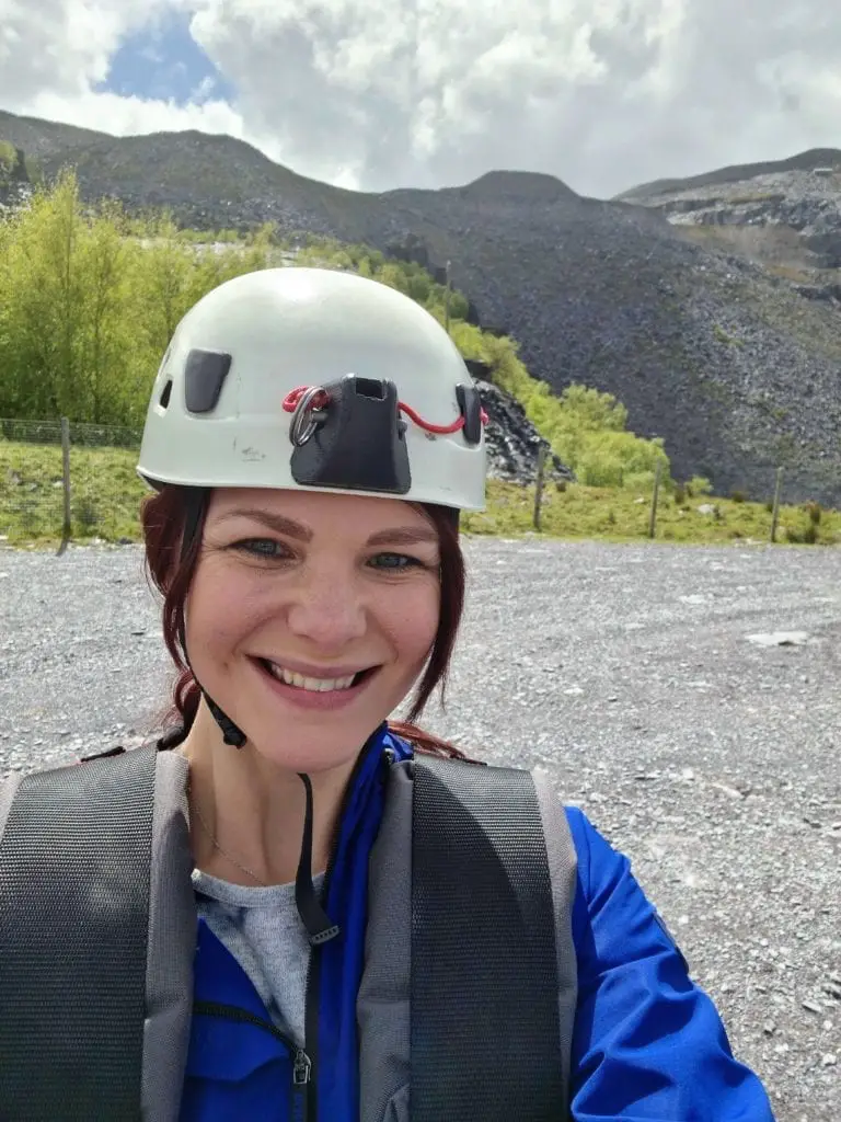 Penrhyn Zip Wire - woman with helmet and safety gear on ready for the zip line 