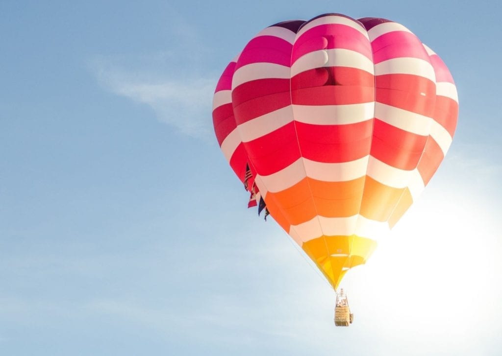 Epics things to do in Marrakech - colourful hot air balloon high in the sky  