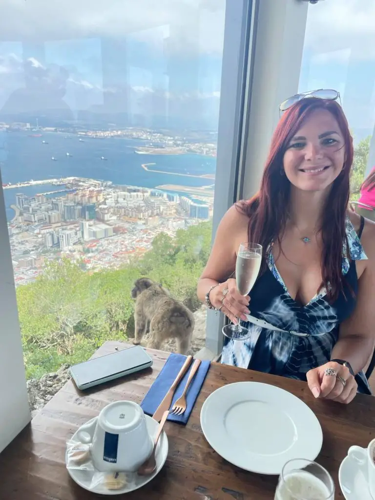Gibraltar Travel Tips - drinking prosecco at the top of the rock watching the monkeys