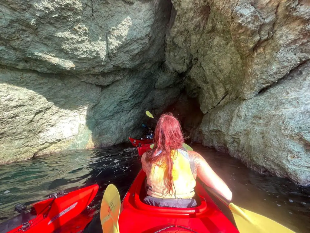 Santorini sunset kayak - dragons mouth sea cave