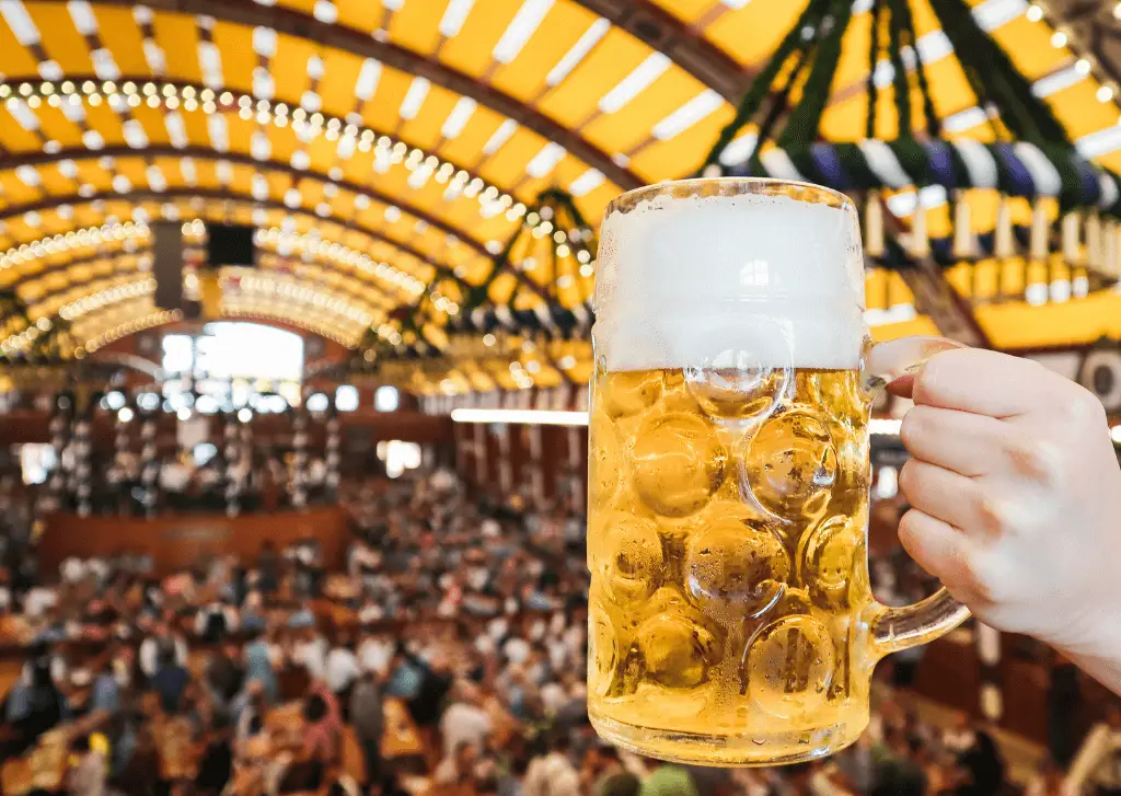 Munich beer festival tent - raising a stein of lager 